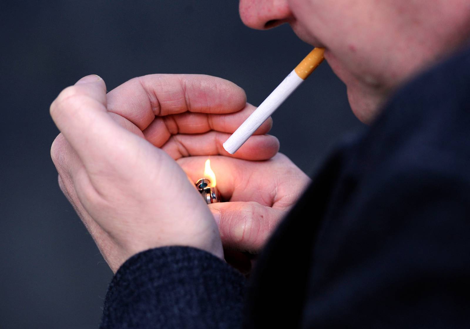 PICTURE POSED MY MODEL
File photo dated 12/03/13 of a man lighting a cigarette as poor diet and smoking are the biggest risks which may cause premature death or disability among people living in England, according to a new study led by Public Health England (PHE). PRESS ASSOCIATION Photo. Issue date: Tuesday September 15, 2015. Researchers found that 40% of the NHS's workload is due to potentially preventable factors and that the impact of an unhealthy diet accounted for 10.8% of the disease burden while tobacco accounted for 10.7%. See PA story HEALTH Expectancy. Photo credit should read: Jonathan Brady/PA Wire