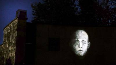 Artist honours Civil War victims with outdoor night-time projections