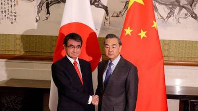 China urges Japan to work with it to improve strained relations