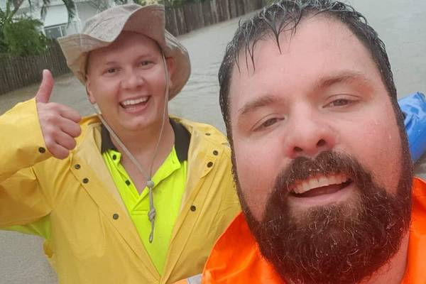 Risking crocs and snakes to rescue Lola the kitten from floods in Queensland