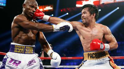 Manny Pacquiao signs off with  win over Timothy Bradley