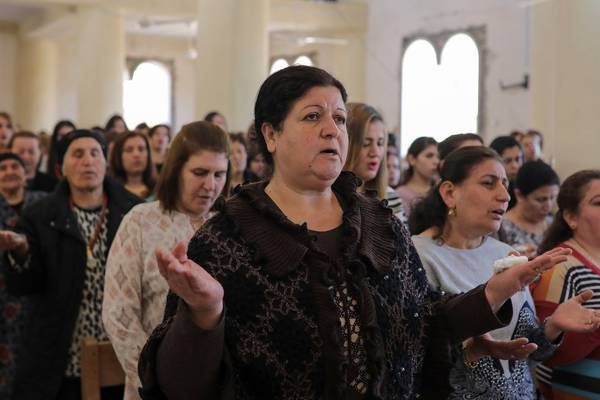 Iraqi Christians gather near Mosul in church damaged  by Isis