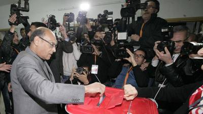 Tunisians vote in landmark presidential run-off election
