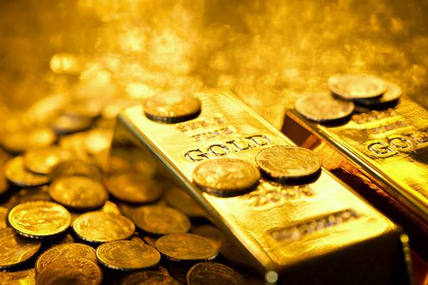 Gold hits near six-year high on US Fed stimulus hints