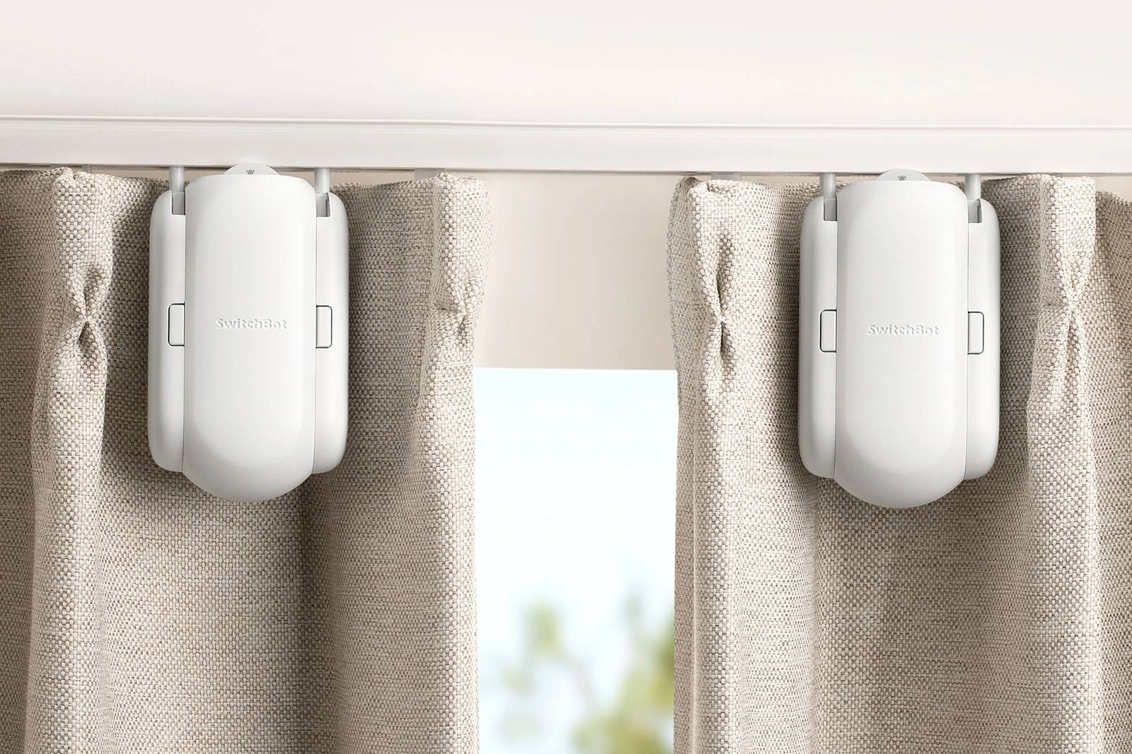 The SwitchBot smart device pictured on a curtain