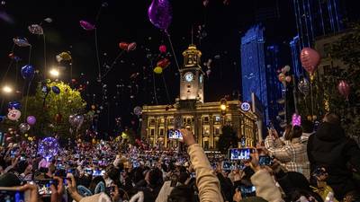 Fireworks explode over empty streets as 2020 slinks away into history