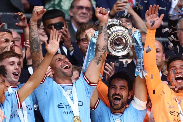 Guardiola urges City players to seize historic treble chance