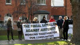 Protesters who picketed Harris demonstrate at Richard Bruton’s home