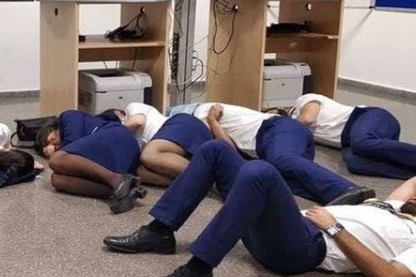 Ryanair sacks six crew who staged photo of sleeping on airport floor