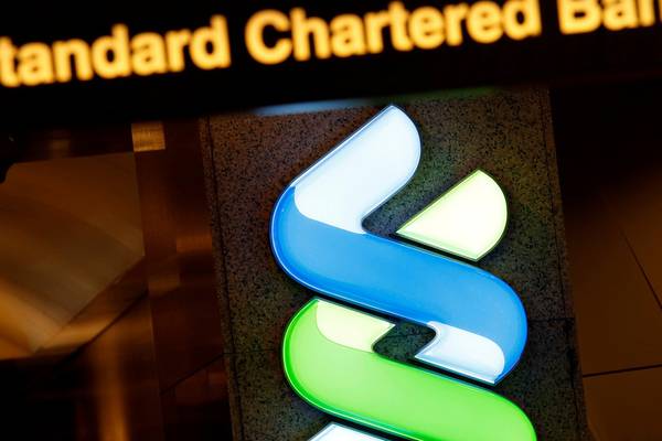 Standard Chartered sets aside $900m to cover US, British fines