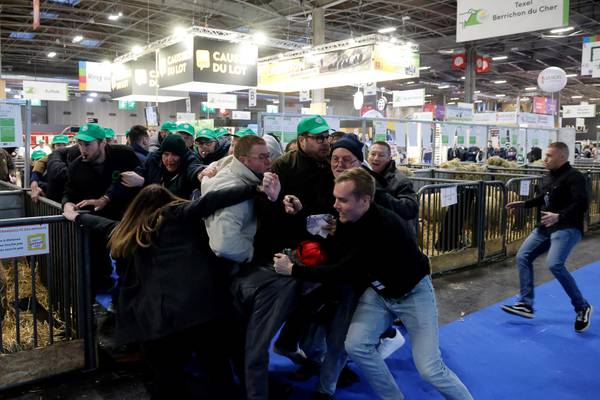 French farmers storm Paris agriculture fair ahead of visit by Emmanuel Macron 