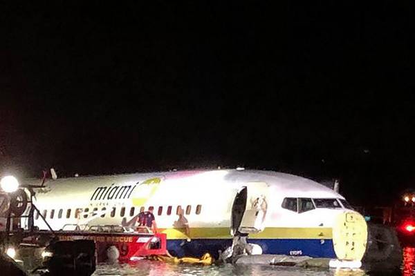 ‘I think it is a miracle’: Boeing 737 slides off runway into river