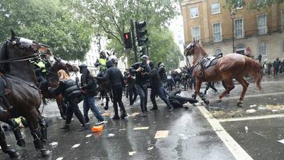 Anti-racism protesters clash with mounted police in London