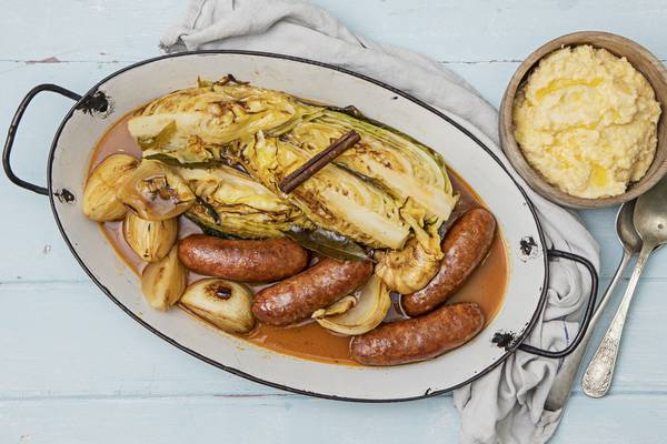 Pot roast Italian sausages with spring cabbage and polenta
