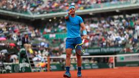 Rafael Nadal faces a battle as play suspended at French Open