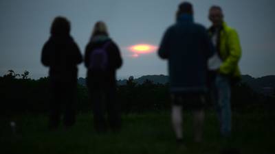 Crowds gather for summer solstice on the Hill of Tara