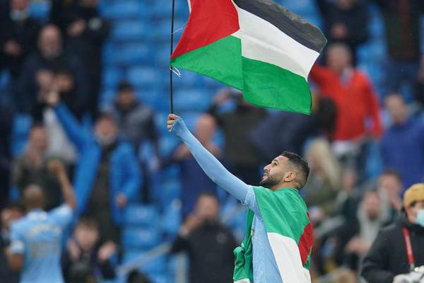 Riyad Mahrez carries Palestine flag as Man City celebrate title