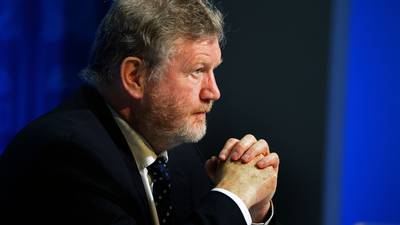 James Reilly  abandons car after it was surrounded by protesters