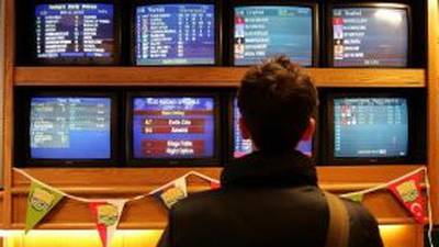 William Hill reports profit at bottom of guidance range