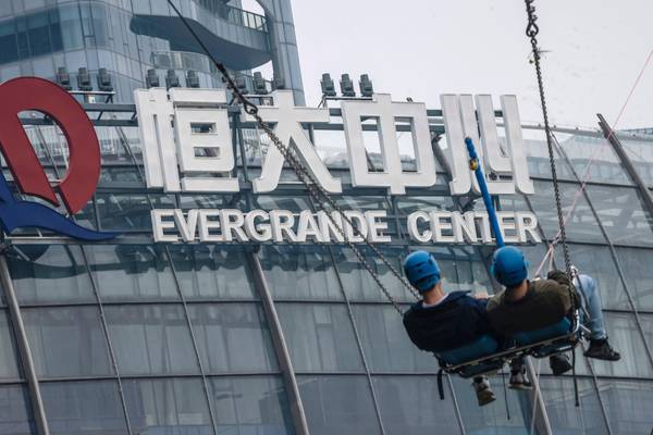 Evergrande shares tumble as new deadline for debt payment looms