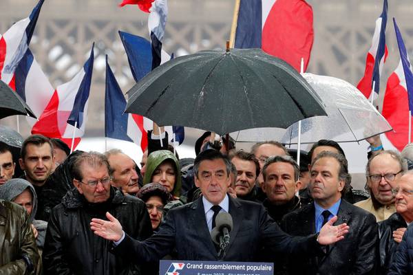 François Fillon stages defiant rally as his campaign struggles