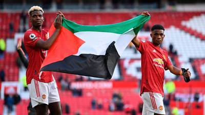 Manchester United players hold up Palestine flag at Old Trafford
