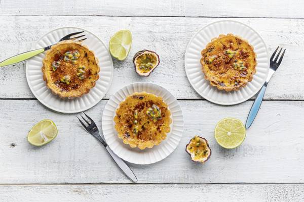 Thirst-quenching and lip-puckering passionfruit and lime crème brûlée tarts