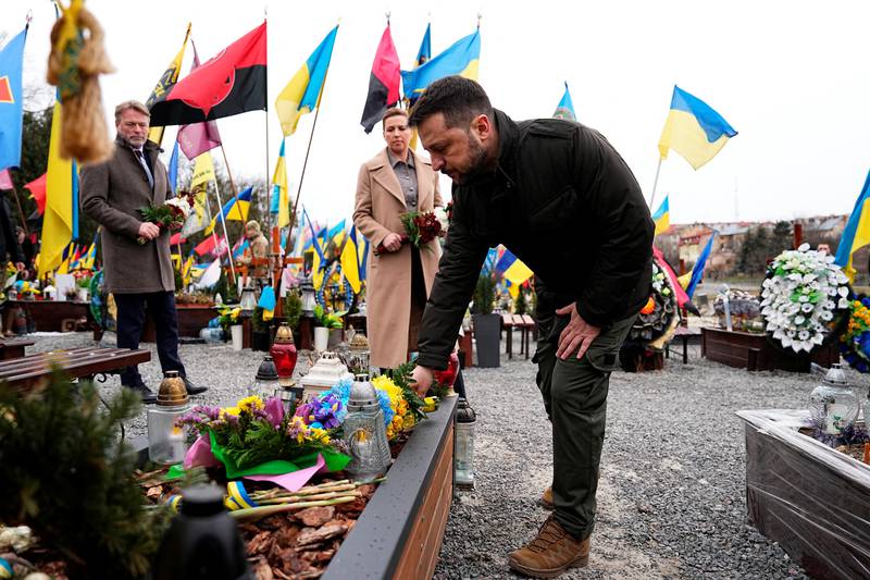 Amid the graves, Zelenskiy vows: ‘We will never forget our Ukrainian heroes’ 