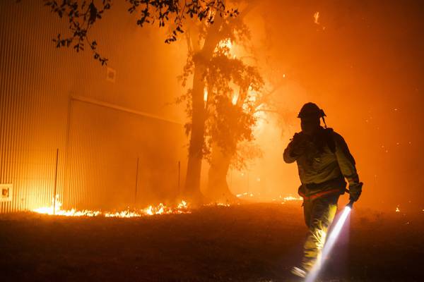 Firefighters get brief respite from winds fanning California wildfires