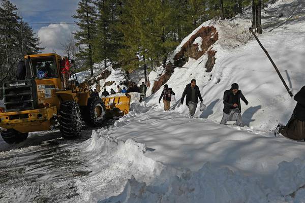 Roads cleared at Pakistan resort after snowstorm kills 22 people stuck in vehicles