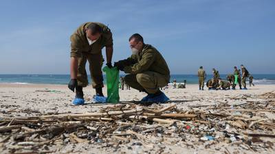 Thousands of volunteers help clean Israel’s beaches after oil spill