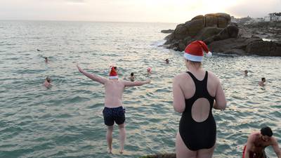 Thousands of festive swimmers take a Christmas Day dip