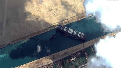 Ship stuck in Suez Canal shifts during refloating efforts