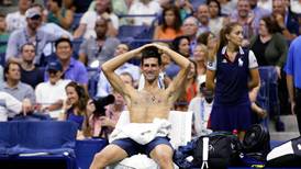 Djokovic conquers conditions to reach US Open semis