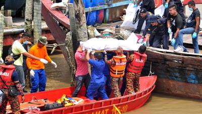 At least 14 migrants killed as boat capsizes off Malaysia