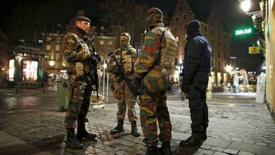Belgians keep   state  of alert and sense of humour in balance