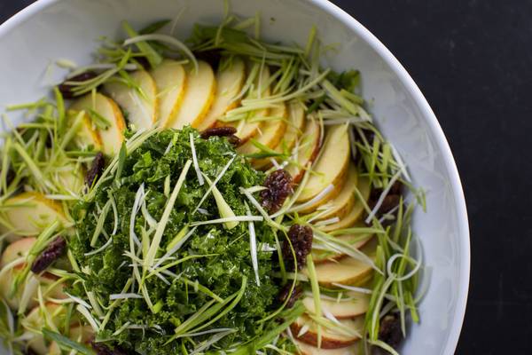 Raw salad of kale, apple, leeks and spiced pecans with a mustard dressing