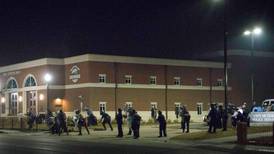 Manhunt in Ferguson after shooting of two policemen