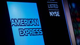 American Express sets aside more cash for bad loans as profit shrinks