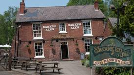 Owners ordered to rebuild the Crooked House pub in England, brick by wonky brick