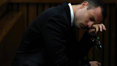 Pistorius opens testimony with tearful apology to Steenkamps