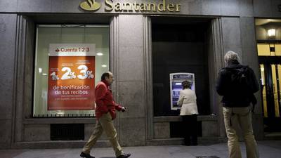 Santander hit by one-off charges, capital improves