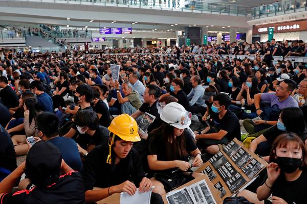 Hong Kong airport shut down as protesters flood terminal