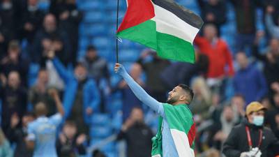 Riyad Mahrez carries Palestine flag as Man City celebrate title
