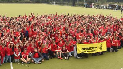 Children wearing red T-shirts in solidarity with refugees