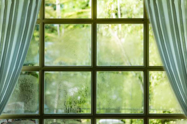 Would double glazing tackle a damp problem around my windows?