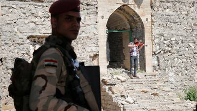 Iraqi violinist returns to Mosul to  play concert at shrine