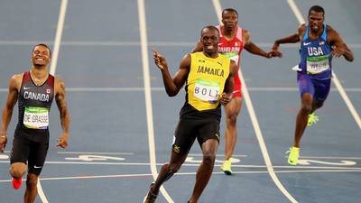 Usain Bolt safely into 200m final as Justin Gatlin crashes out