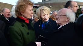 President Higgins leads mourners at Dublin funeral of widow of former president