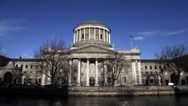 Man wanted over 2007 double murder brought before Dublin High Court